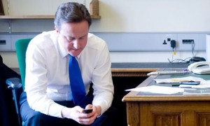 David Cameron using his mobile phone